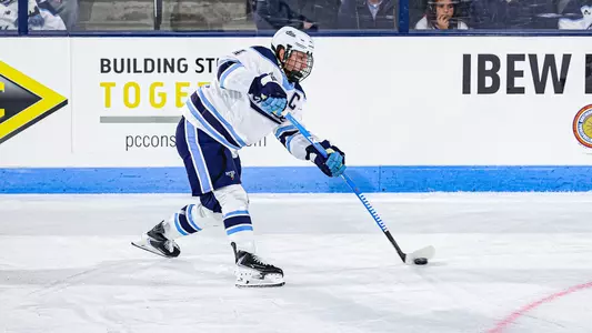 Brandon Holt shoots the puck.