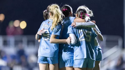 Maine women's soccer celebrates a goal.