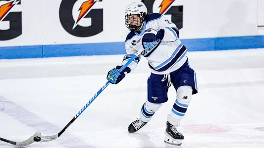 Lukas Peterson shoots the puck.