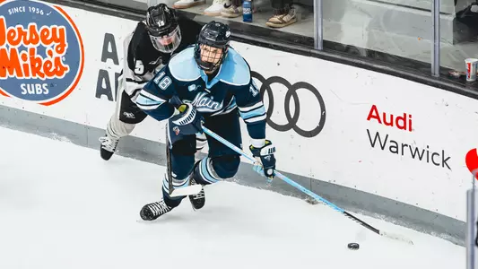 Taylor Makar with the puck