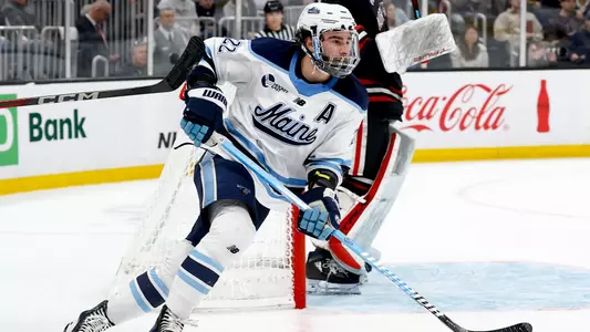 Harrison Scott skates by the net