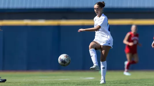 Madison Michaud kicks the ball.