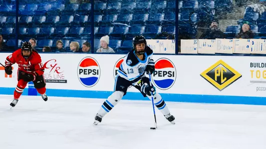 Mikayla Boarder skates towards goal