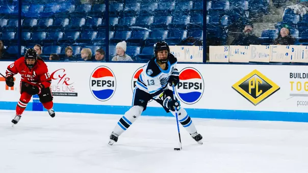 Mikayla Boarder skates towards goal