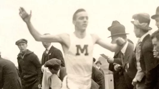Frank Preti runs a race for UMaine in the early 1900s.