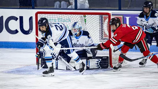 Kiia Lahtinen preparing for a shot with Paige Fong in front