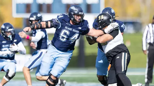 Jack Boutaugh throwing a block against Bryant