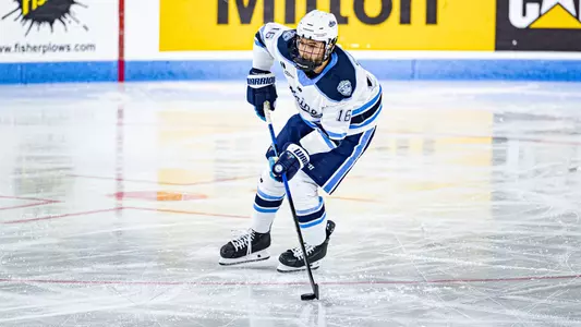 Loic Usereau carries the puck.