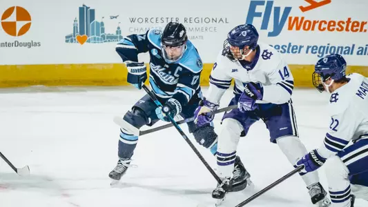 Owen Fowler battles for the puck.