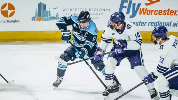 Owen Fowler battles for the puck.