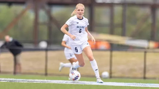 Abbey Thornton dribbles the ball.