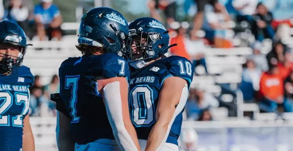 Sam Oppenheimer and Noah Carpenter celebrate a sack