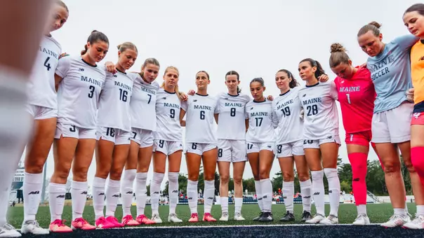 Maine women's soccer huddles pregame.