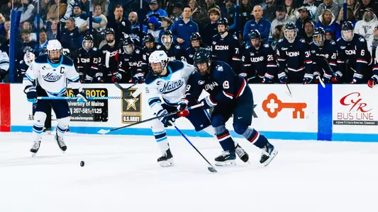 Loic Usereau battles for the puck