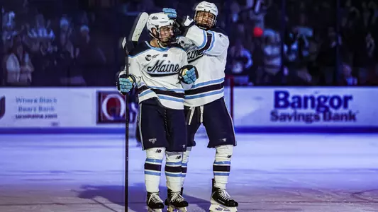 Brandon Holt celebrates with Josh Nadeau
