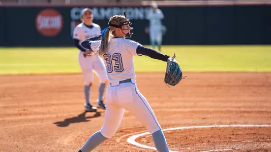 Alysen Rieth throws a ball to first.