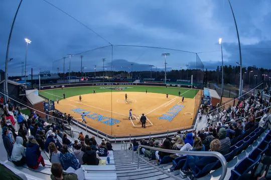 Wide shot of the Pierre & Catherine Labat Softball Complex during a night game.