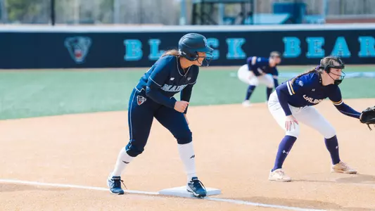 Madison Hand gets ready to run on third base.