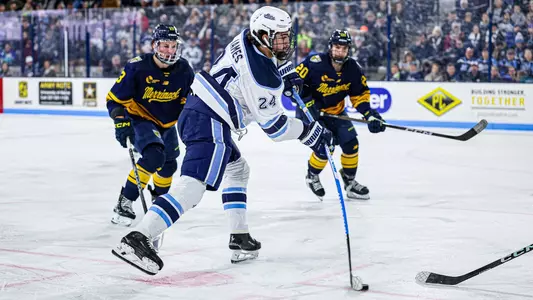 Brock James shoots the puck.