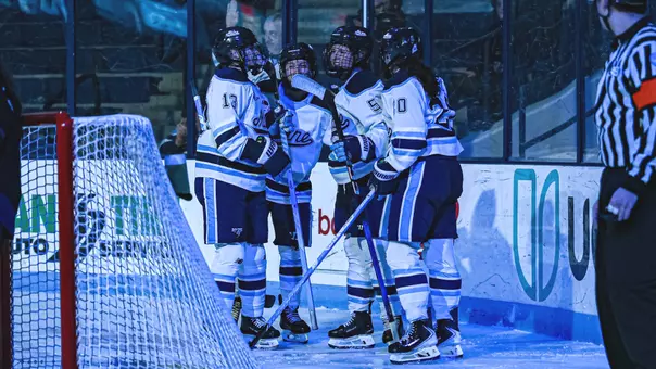 Maine women's hockey celebrates a goal.