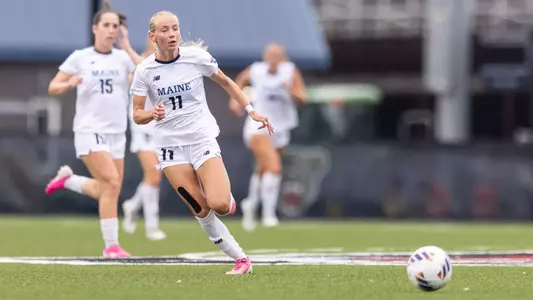 Teagan Atherley dribbles the ball up the field.
