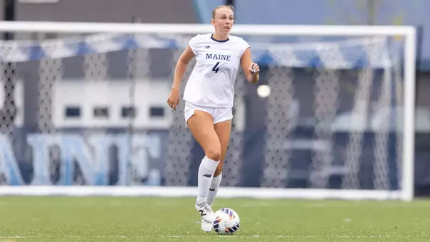 Meghan Bernetti dribbles the ball up the field.