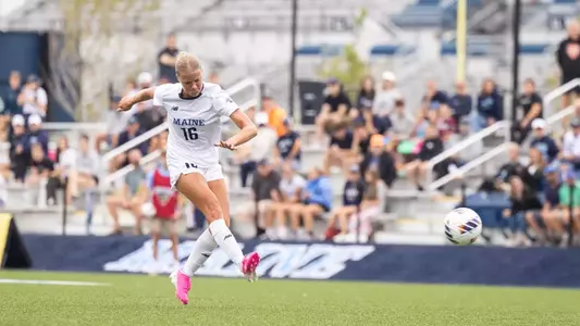 Olivia Grisdale kicks the ball up the field.