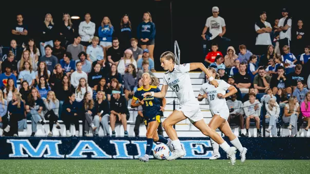 Hannah Wehmeyer dribbles the ball up the field.