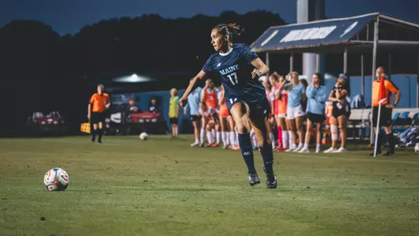 Isabella Meadows dribbles the ball.