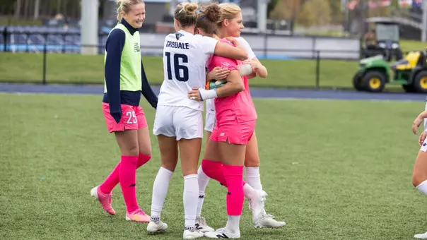 Olivia Grisdale hugs Elena Barenberg.