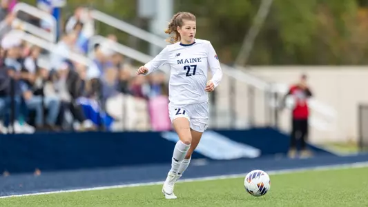 Hannah Wehmeyer dribbles the ball up the field.