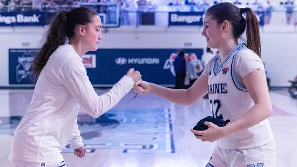 Izzy and Olivia during starting lineups.