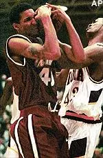 Micah Brand, left, wrestles with Iona center Nakiea Miller for posession of the ball in the first half Saturday night.