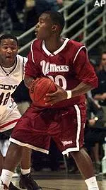 Shannon Crooks looks for an opening past UConn's Khalid-El Amin in the first half of Monday night's game.