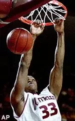 Massachusetts' Kitwana Rhymer dunks during the first half of their game against Rhode Island at the Mullins Center on Saturday.