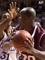 Virginia Tech's Russ Wheeler defends against Massachusetts' Winston Smith in the first half Saturday.