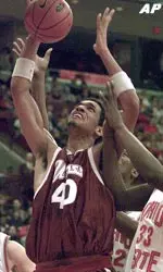 UMass' Micah Brand pulls in a rebound over two Ohio State players during the first half.