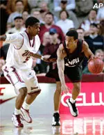 Monty Mack plays defense against Temple's Lynn Greer during first half action Tuesday night.