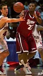 Chris Kirkland passes around Temple's Pepe Sanchez in the first half of their Atlantic 10 semifinal game Friday.