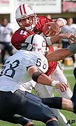 Freshman quarterback Matt Guice is met by New Hampshire defender Chris Robinson on a keeper in the third quarter.