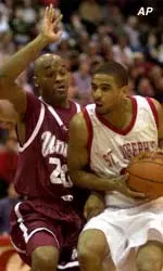 St. Joseph's' Frank Wilkins (21) drives to the basket against Massachusetts' Winston Smith in the first quarter Tuesday, Feb. 27, 2001, in Philadelphia.