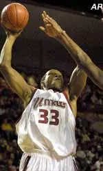 Kitwana Rhymer shoots over Fordham's Jeff McMillan during UMass' victory at the Mullins Center Saturday.