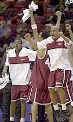 UMass players celebrate their 75-70 win over St. Joseph's in the Atlantic 10 semifinals Friday.