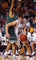 Jeff Viggiano tries to get around Marshall's Monty Wright in the first half.