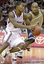 Shannon Crooks drives past GW's Chris Monroe in the second half.