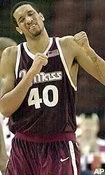 Massachusetts' Micah Brand reacts after missing a shot in the second half against Xavier during the second round of the Atlantic 10 conference men's tournament.