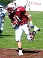 Jason Peebler scores one of his three touchdowns in a 52-3 win over CCSU.