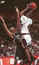 Gabe Lee shoots over Xavier's David West during the first half Saturday.