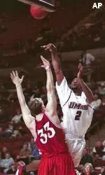 Gabe Lee shoots over Hartford's Sean Regan during the first half.