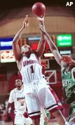 Rashaun Freeman shoots over Vermont's Scotty Jones during the first half.